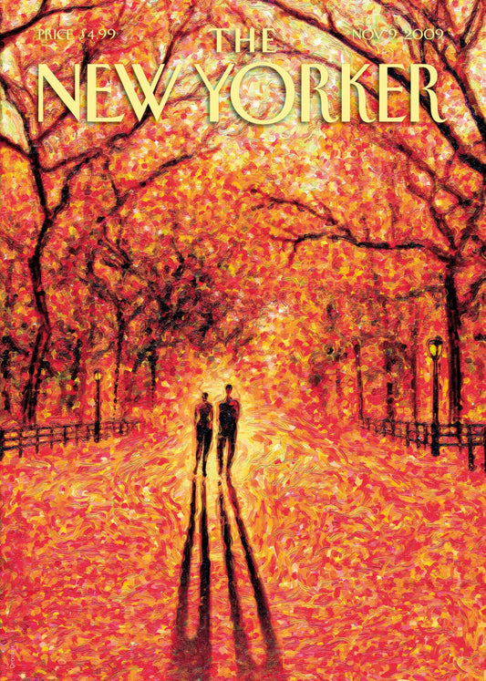 Romantic couple walking beneath glowing autumn trees in New York