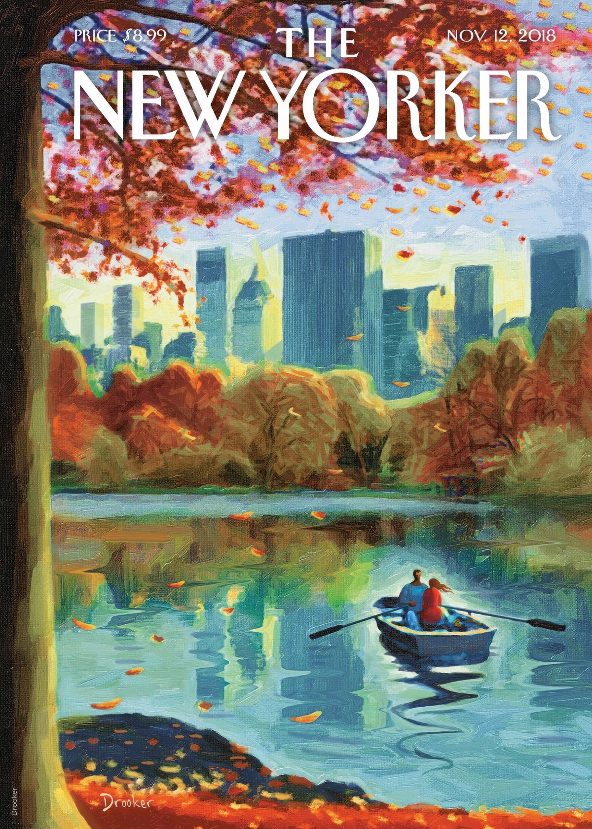 Couple in a rowboat on a New York park lake during autumn